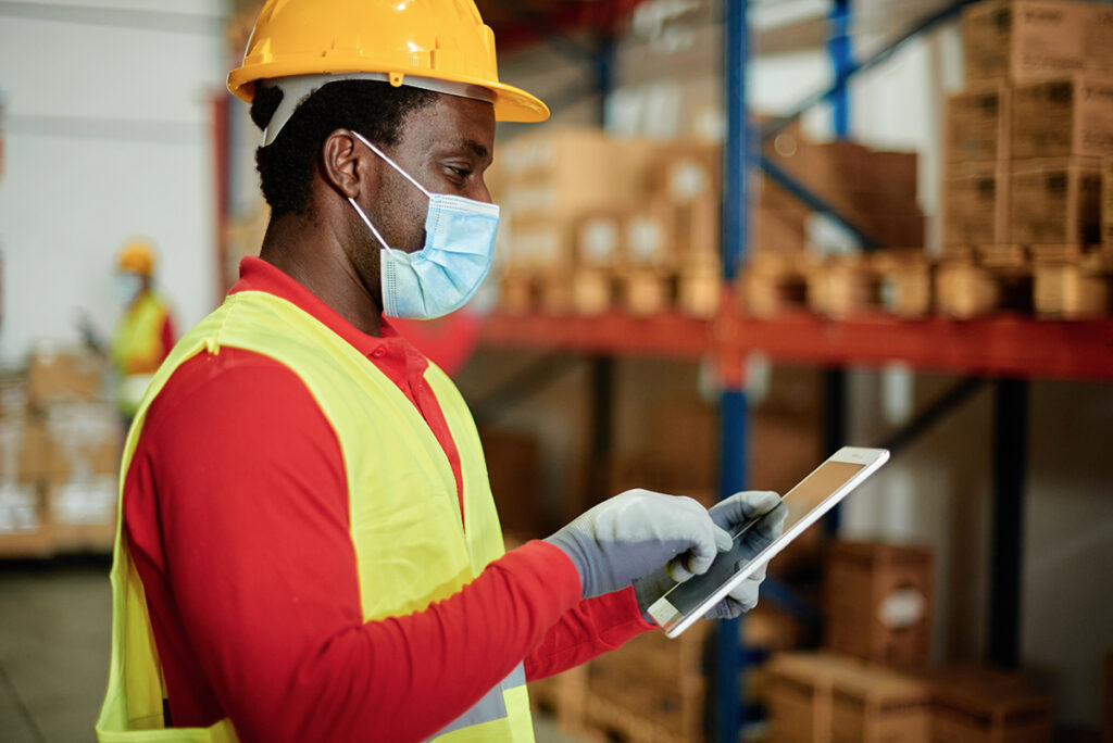 pharmaceutical worker using warehouse management software